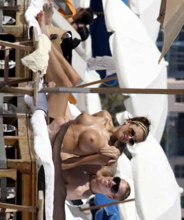 Oksana Andersson - Topless sunbathing