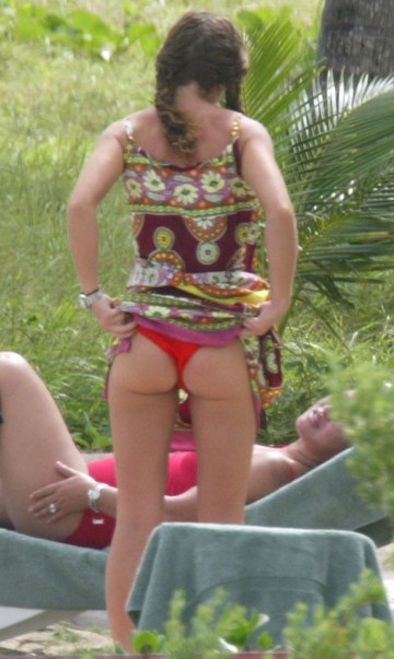 Rebecca Gayheart - Topless sunbathing
