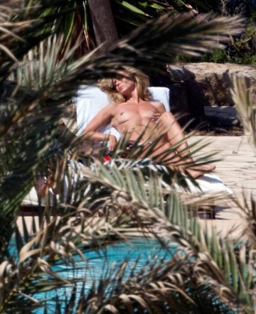 Heidi Klum - Topless sunbathing