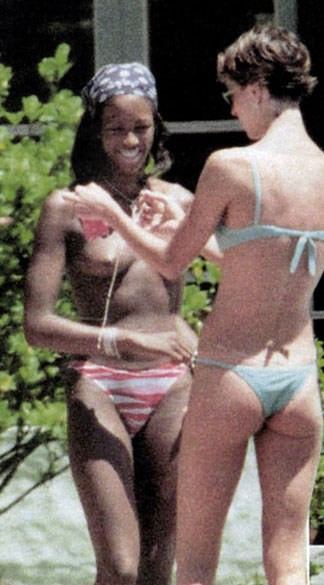 Naomi Campbell - Topless sunbathing