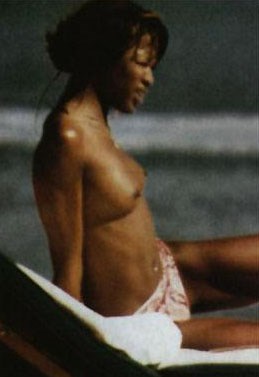 Naomi Campbell - Topless sunbathing