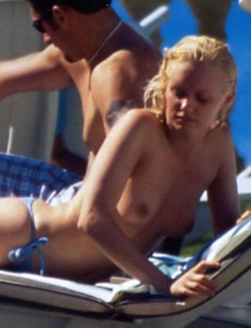 Justine Mattera - Topless sunbathing