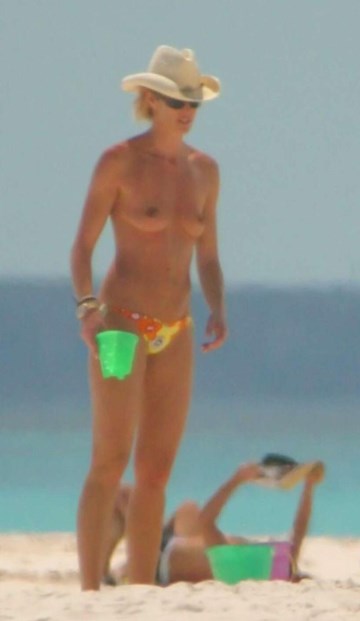 Elle Macpherson - topless at the beach