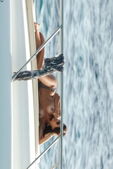Danielle Bux   - Topless sunbathing