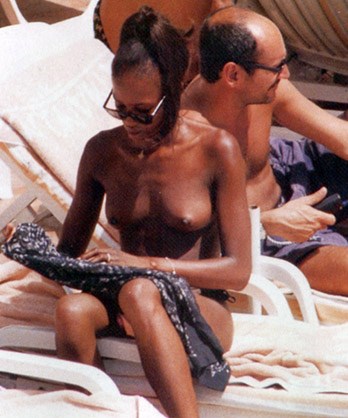 Naomi Campbell - Topless sunbathing