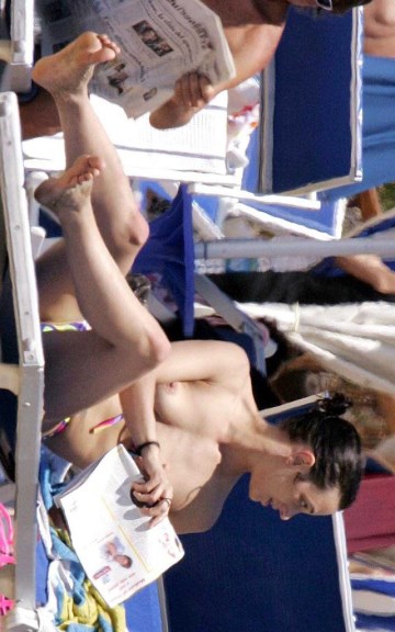 Asia Argento - Topless sunbathing