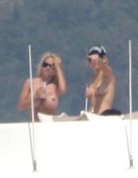 Pamela Anderson - Topless sunbathing
