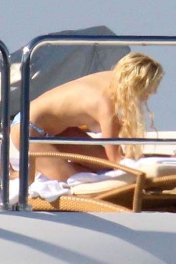 Paris Hilton - Topless sunbathing