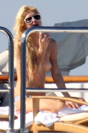 Paris Hilton - Topless sunbathing