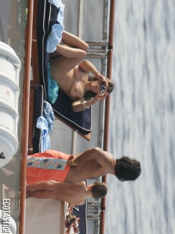 Elizabeth Hurley - Topless sunbathing