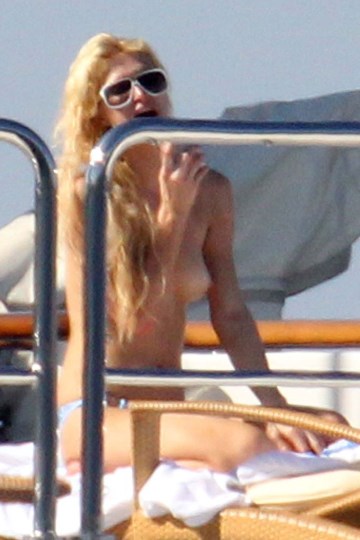 Paris Hilton - Topless sunbathing