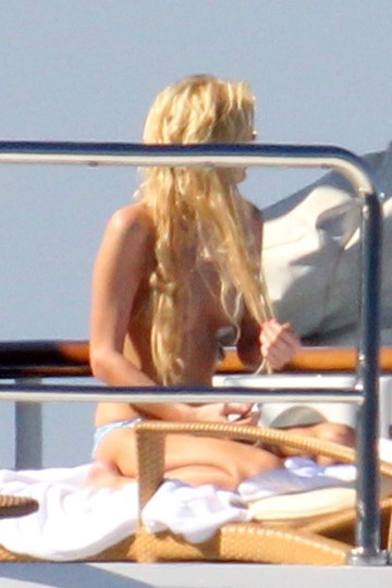 Paris Hilton - Topless sunbathing