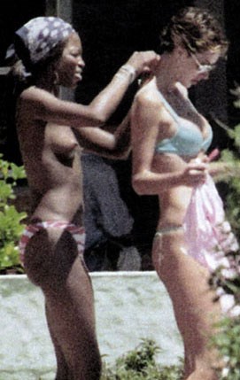 Naomi Campbell - Topless sunbathing