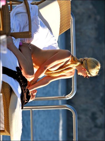 Paris Hilton - Topless sunbathing