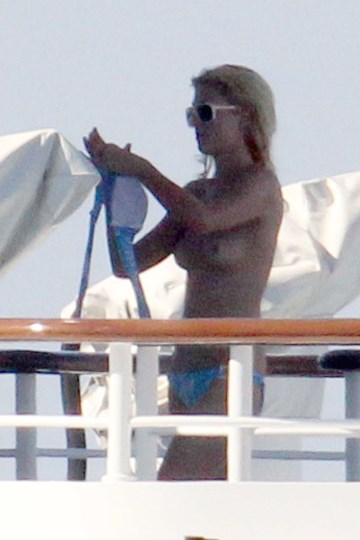 Paris Hilton - Topless sunbathing