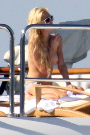 Paris Hilton - Topless sunbathing