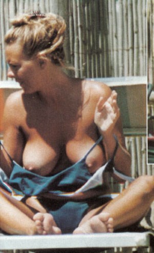 Paola Perego - Topless sunbathing