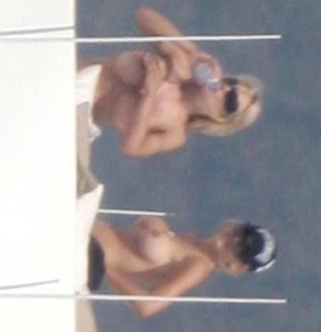 Pamela Anderson - Topless sunbathing