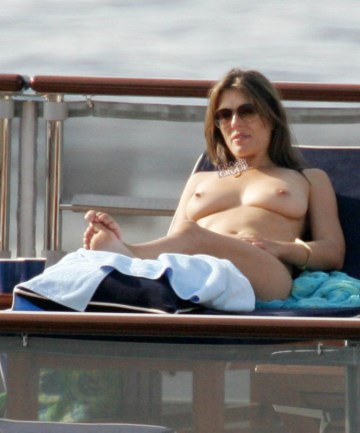 Elizabeth Hurley - Topless sunbathing