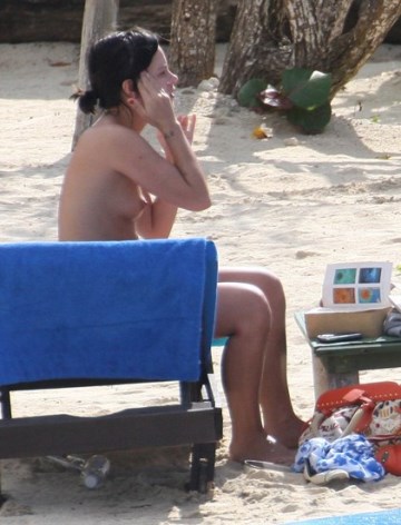 Lily Allen - Topless sunbathing