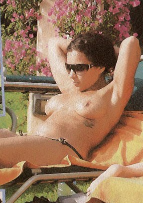 Nadja Benaissa - Topless sunbathing