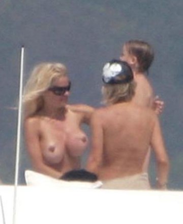 Pamela Anderson - Topless sunbathing