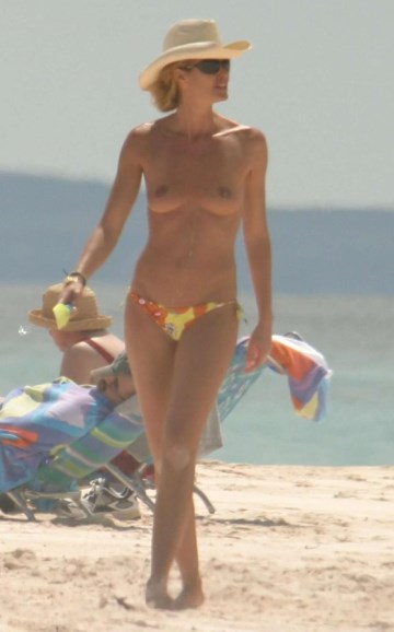 Elle Macpherson - topless at the beach