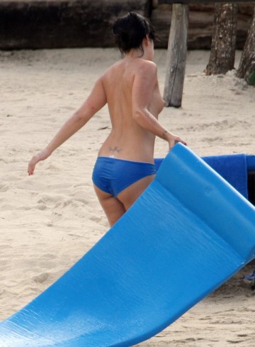 Lily Allen - Topless sunbathing